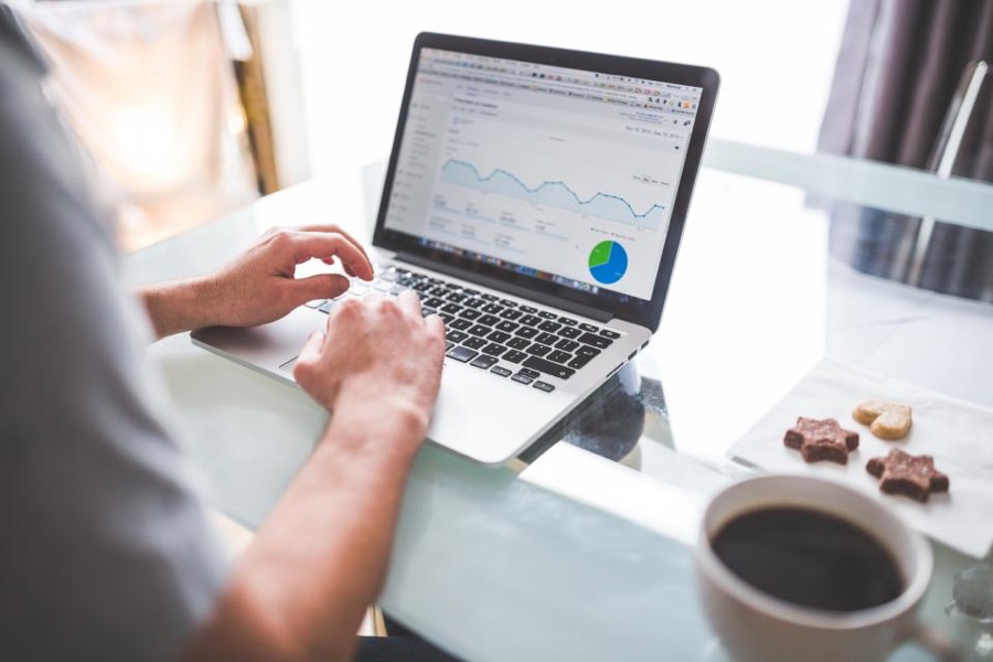 Someone reviewing a website analytics dashboard on a laptop